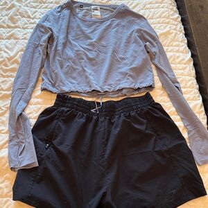 Gymshark Dusty Purple Performance Top and black shorts